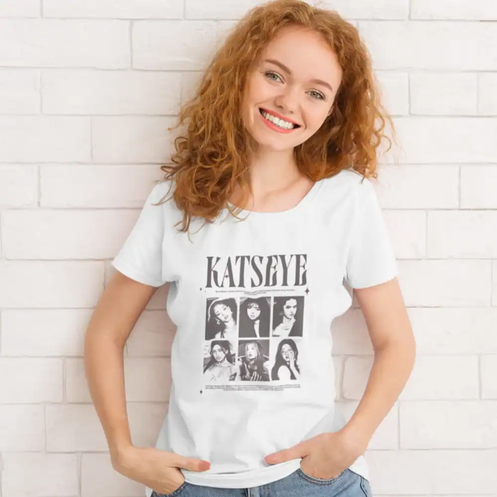 blonde girl smiling wearing white katseye tshirt with popular design
