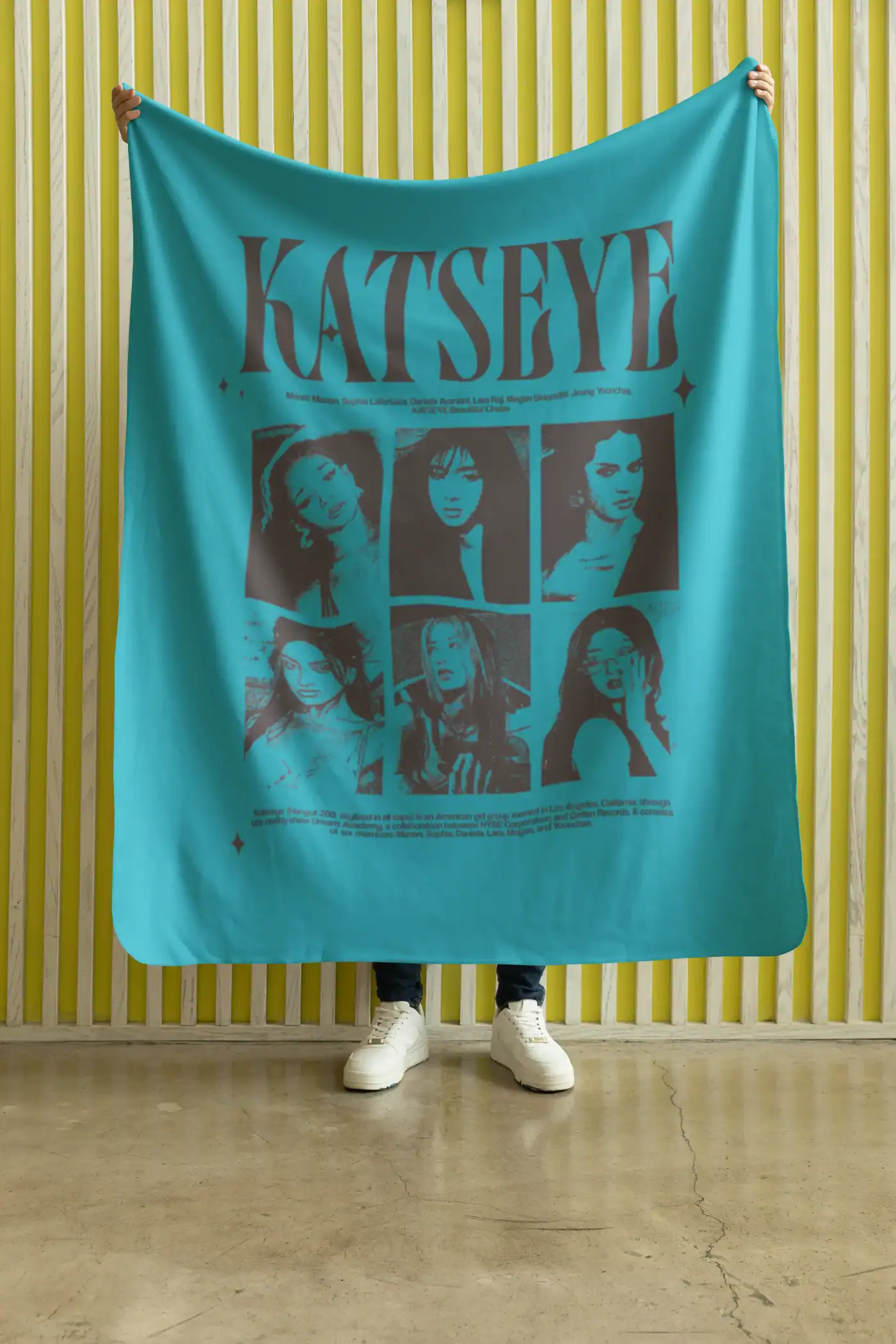 model holding green katseye flannel blanket with band members design