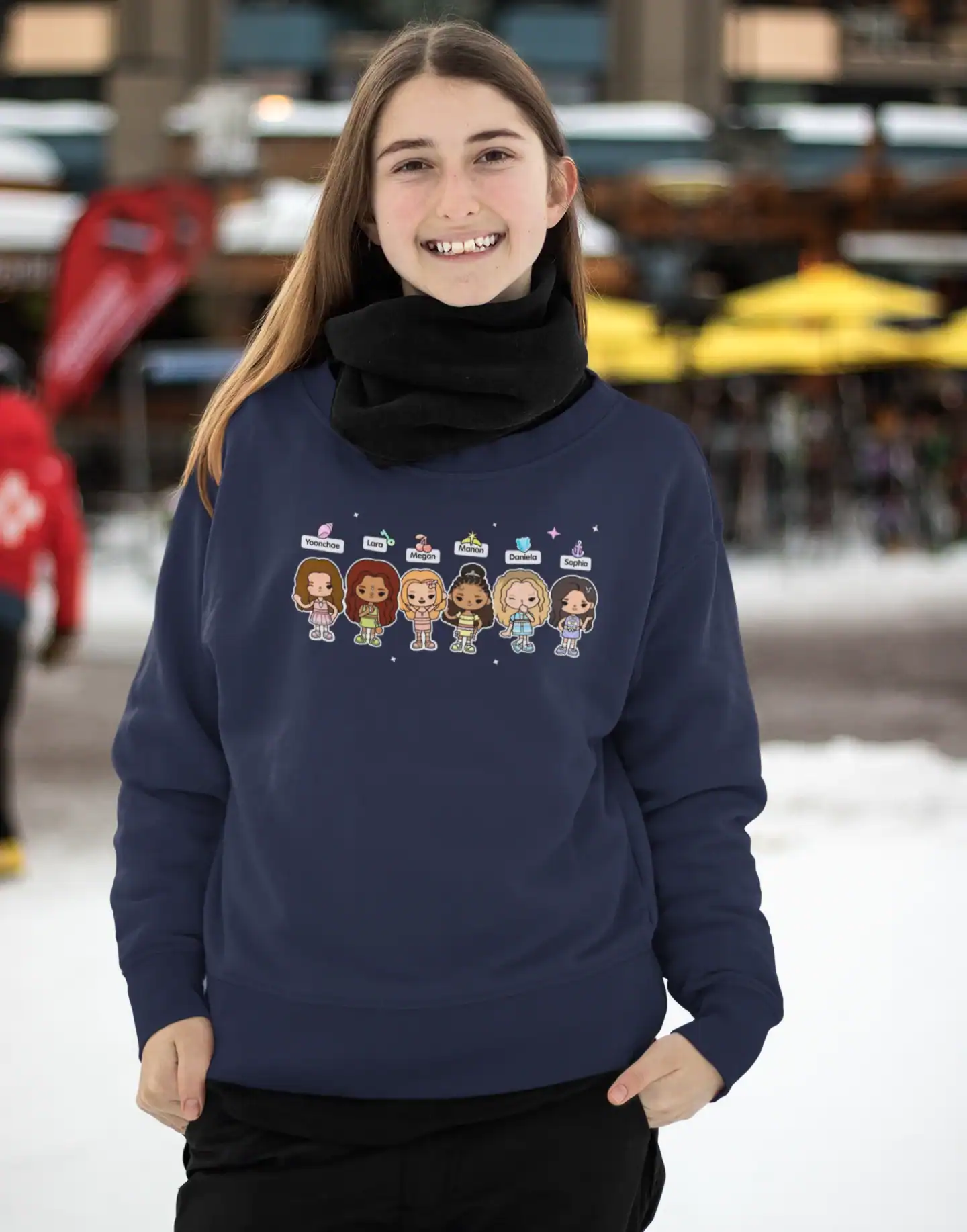 smiling white girl wearing blue katseye sweatshirt