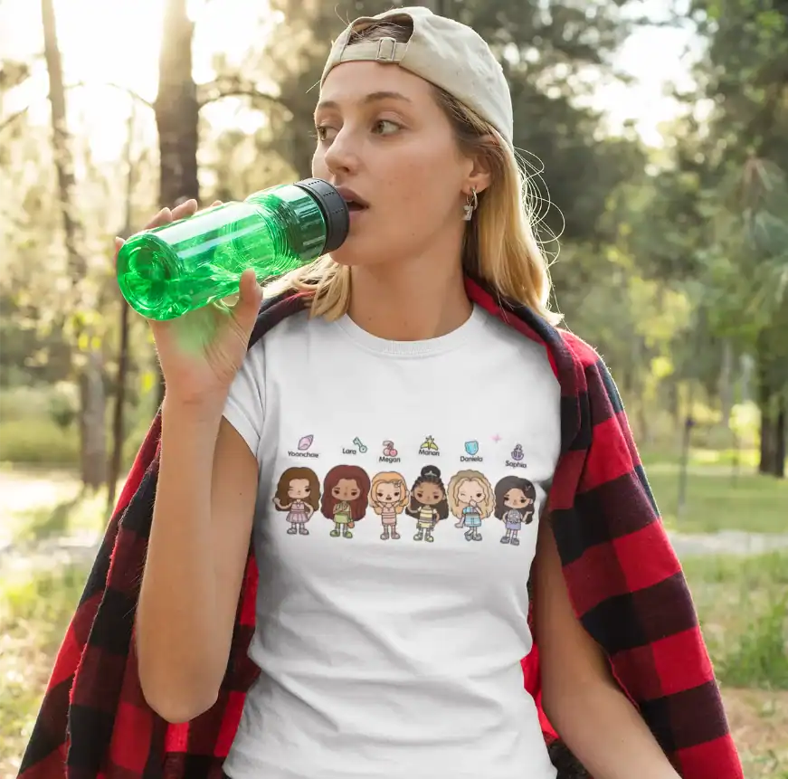 pretty girl wearing white katseye x toca boca t-shirt while drinking water from green bottle